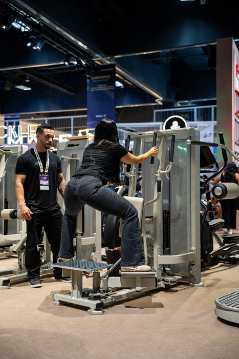 Rear three-quarter view of the GluteLeader GL-1006 Standing Hip Adductor in use