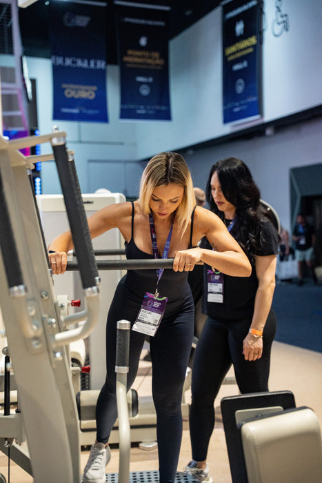 Athlete adjusting the GluteLeader Multi-Hip GL-1009 training position