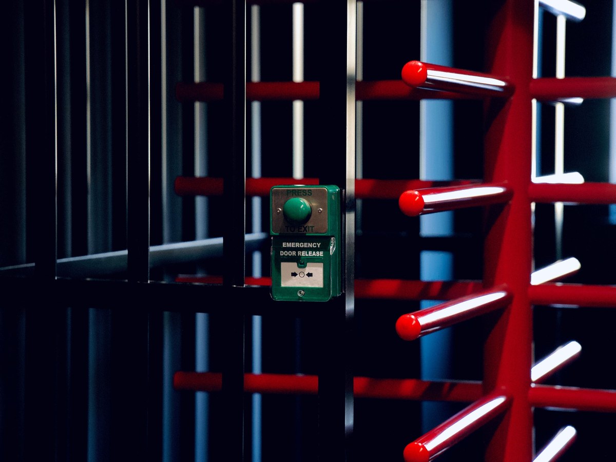 Full-height red and black turnstile rotor and access controls